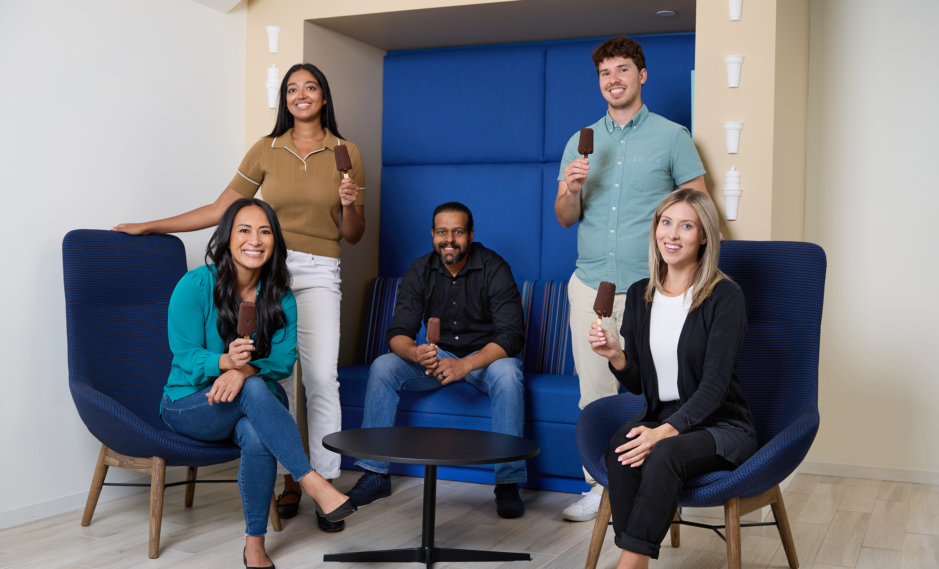 coworkers holding Dilly Bars